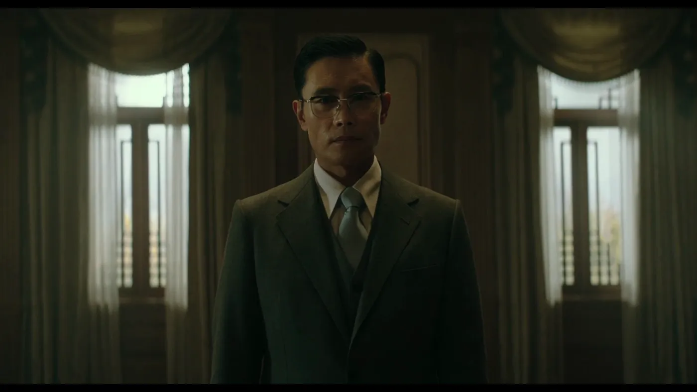 The Man Standing Next