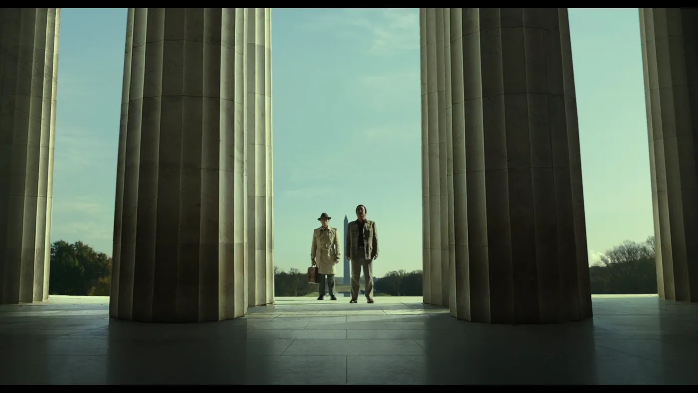 The Man Standing Next