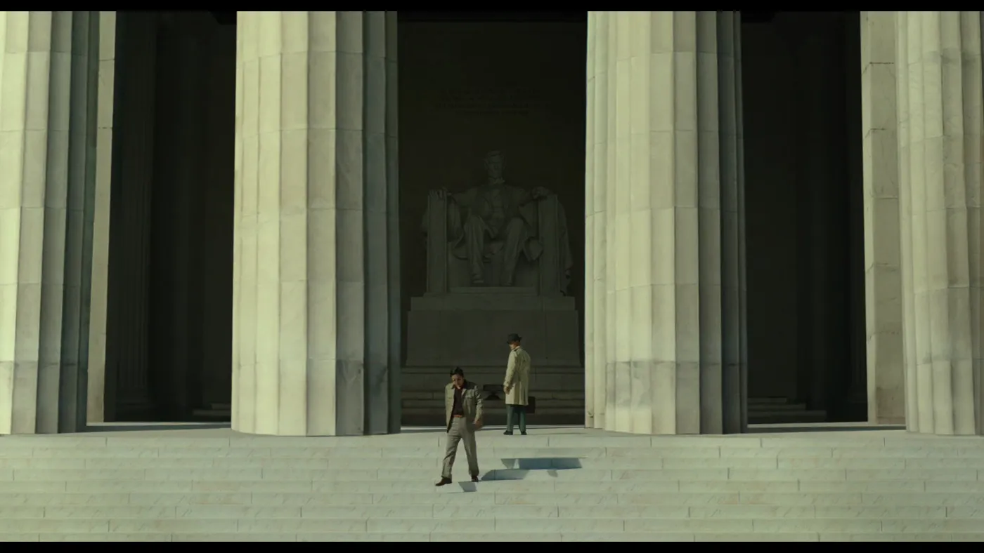 The Man Standing Next