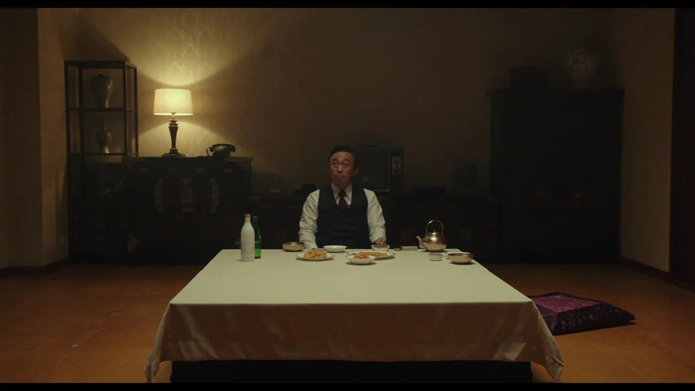 The Man Standing Next